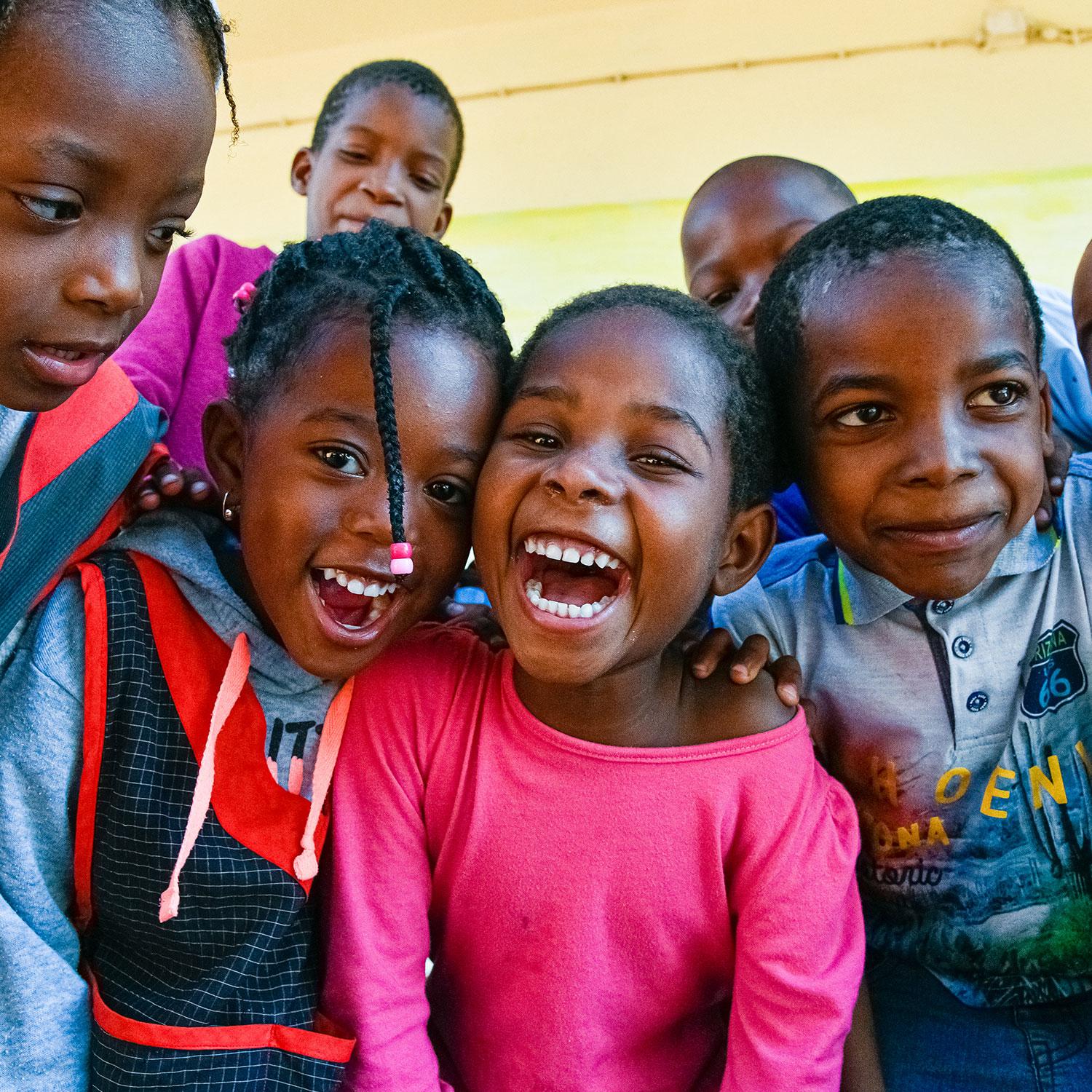 Smiling Tanzanian schoolchildren supported by We See Africa community programs