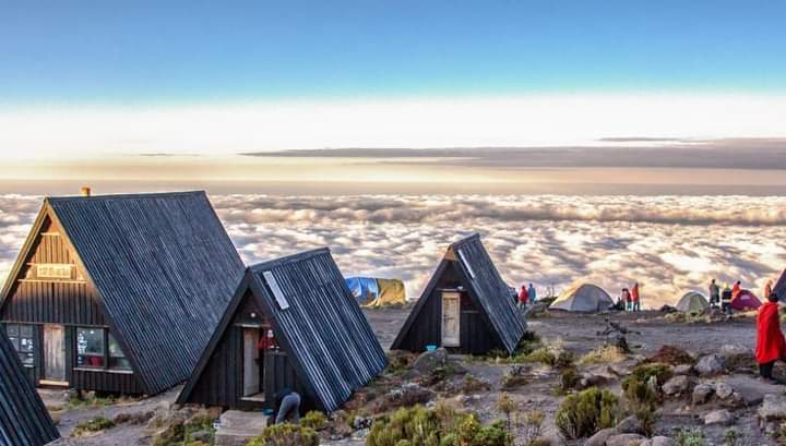 A-frame huts on the Marangu route above a sea of clouds