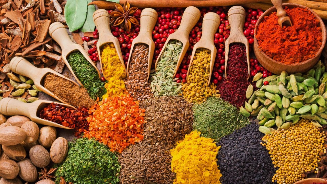 Spices, cinnamon, cardamom and chilli laid out at a Zanzibar spice market